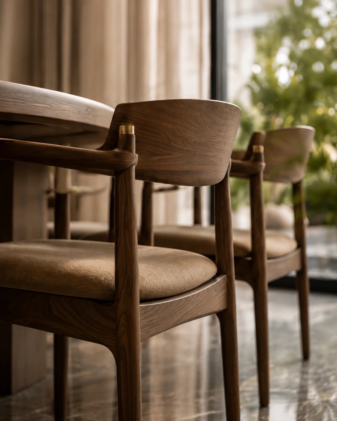 Solid walnut dining chairs against sheer curtains
